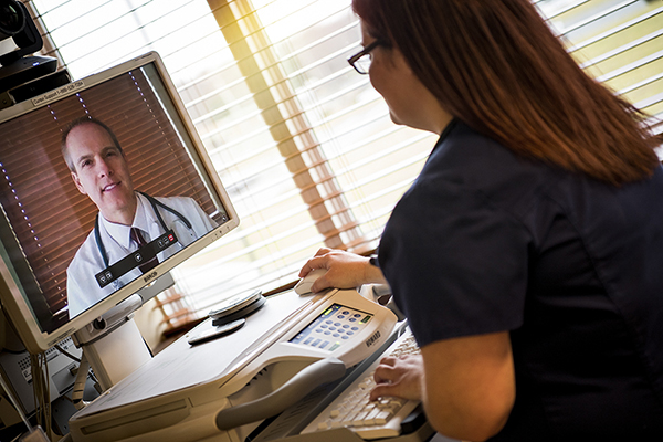 Telehealth nurse on computer