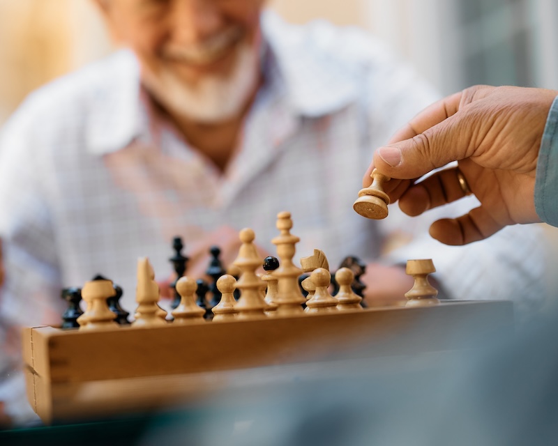 Close-up of seniors playing chess