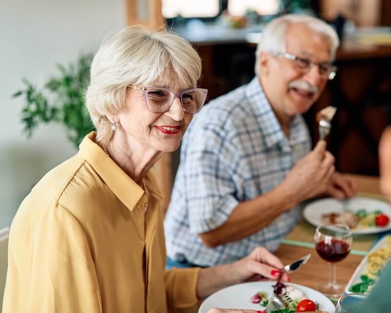 Senior couple enjoying a meal together in a dining room
