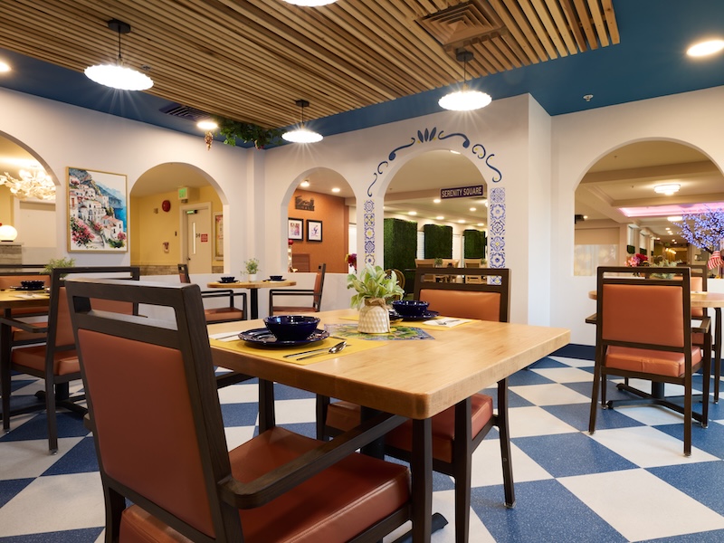 Dining room with checkered floor and arched doorways at Lorien Harmony Park